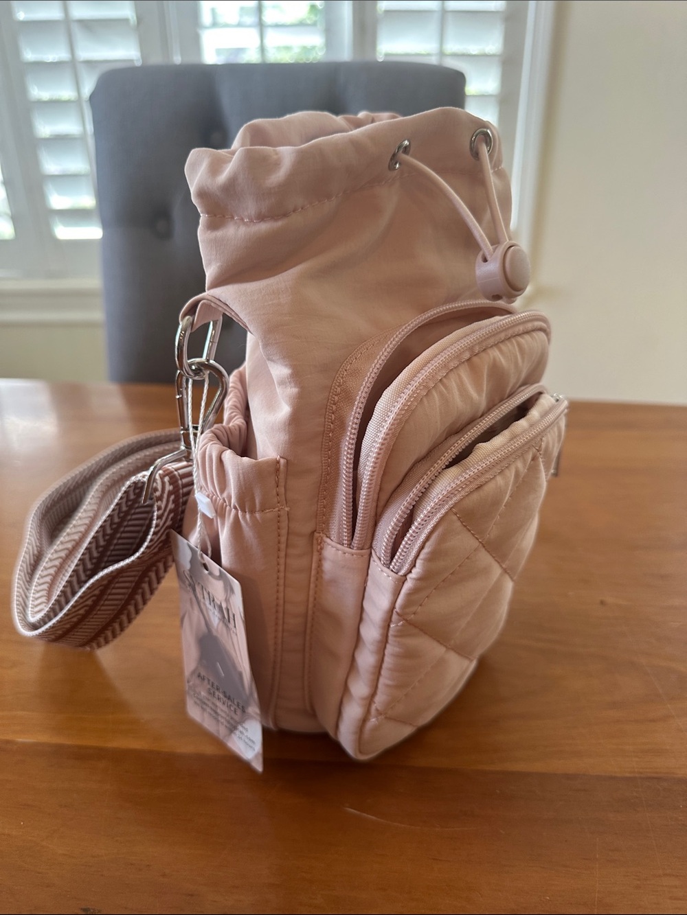 SYTRAH quilted pink water bottle sling bag with an insulated compartment